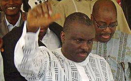 James Ibori raises his arm as he leaves a courtroom in Nigeria after being cleared of corruption charges in 2009