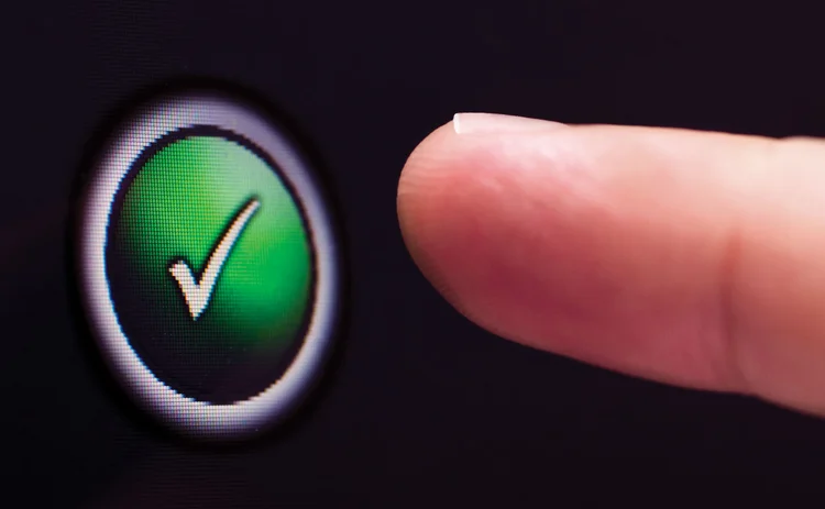 Finger on approval button