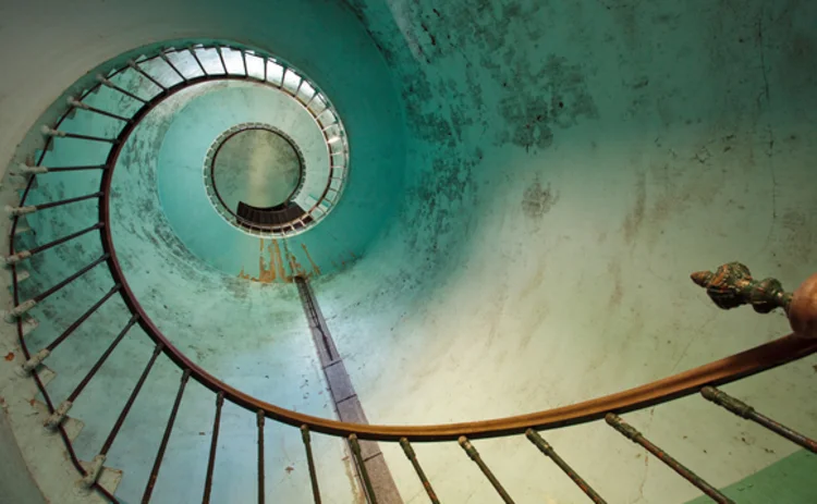 looking-up-at-a-sweeping-spiral-staircase
