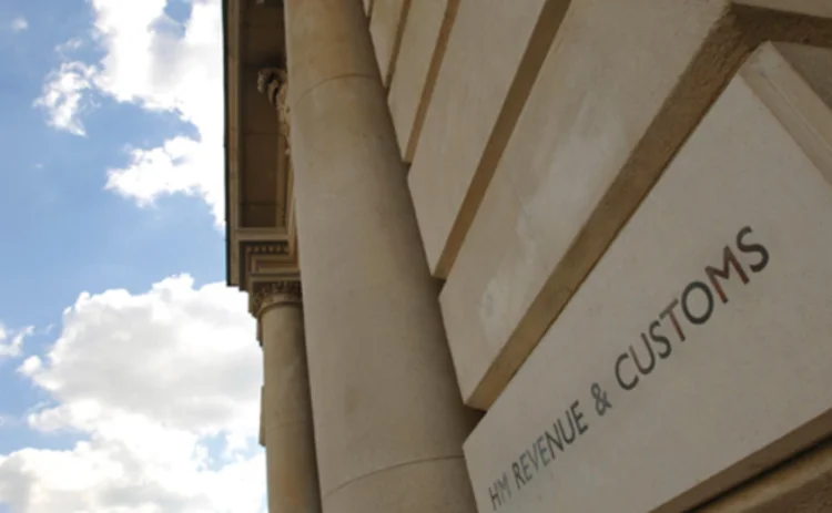 A photo of the HMRC building against a cloudy sky