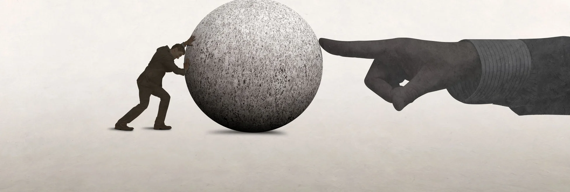 A man pushes a large concrete ball, while a hand on the other side tries to stop it moving