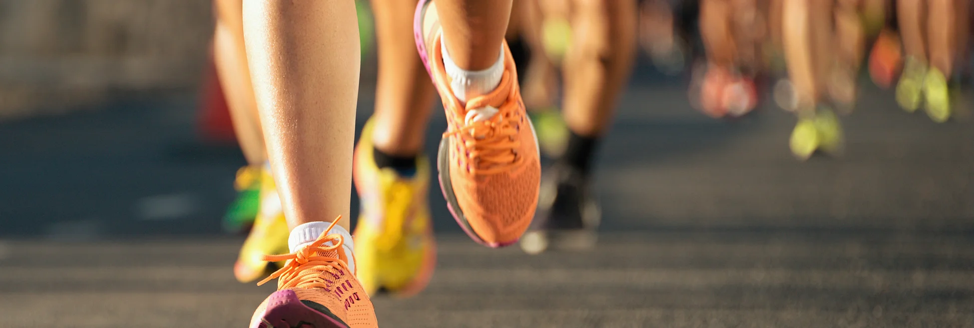 A photo of runners’ legs in a marathon