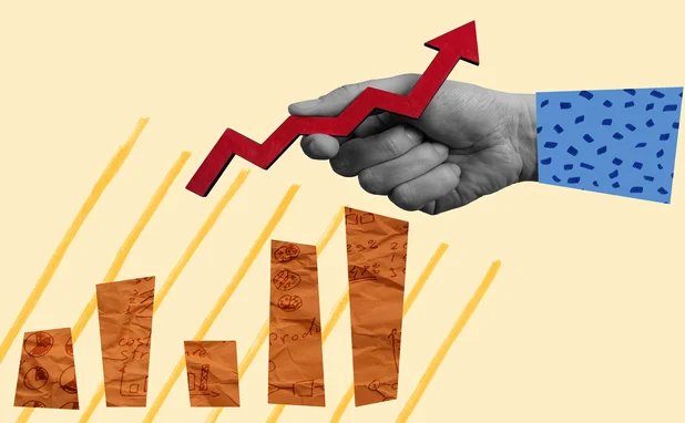 A hand is moving the line section of a line and bar chart