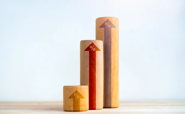 Wooden blocks with arrows pointing up