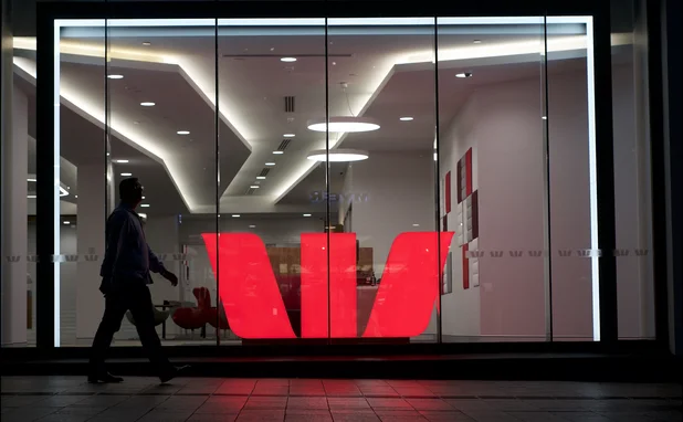 Westpac logo illuminated in a glass window