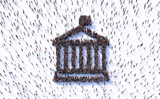 Human crowd forming a bank symbol on white background.