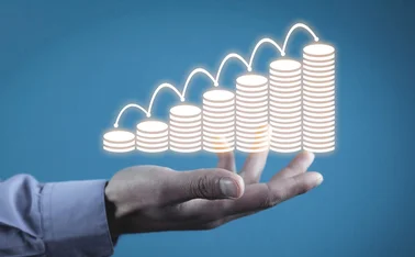 A bar chart made up of coins is increasing in height