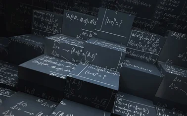 Blackboard blocks with mathematical formulas written in chalk all over them 
