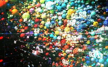 Thousands of coloured balls with an image of data overlaid