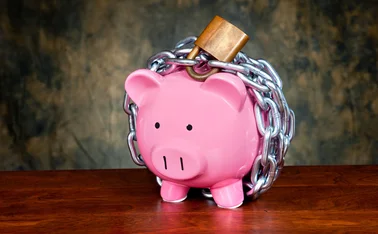 a piggy bank in chains