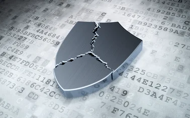 Broken silver shield on digital background