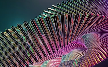 Abstract geometric spiral of illuminated metallic lines forming a dynamic 3D structure, symbolizing AI transformation, scalable data architecture, and the simplification of complex systems into intelligent digital frameworks