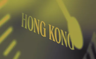 Hong Kong signage behind clock detail