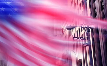 Blurred US flag on Wall Street
