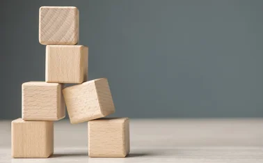 Unstable pile of wooden blocks