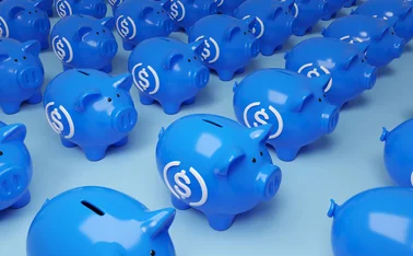 Blue, stablecoin-labelled piggy banks 