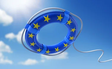 A life belt with the EU flag styling on it is being thrown into the water