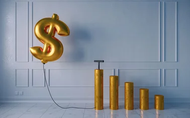 Pumped golden balloon shaped of dollar sign with the growing bar graph on white wall