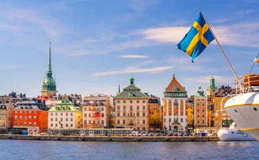 Stockholm old town and flag