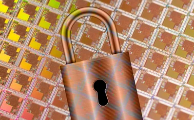 Padlock against a sheet of silicon wafers