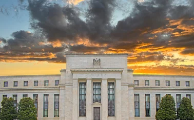 Federal Reserve with a dramatic cloudy background