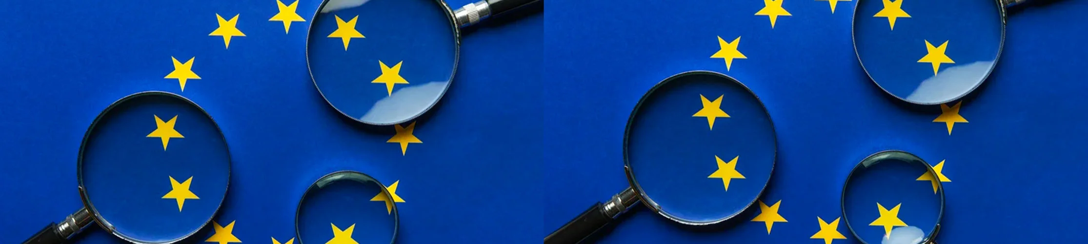 EU flag with three magnifying glasses hovering over it