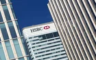 HSBC HQ, London, sandwiched between two skyscrapers, seen at a 45-degree angle