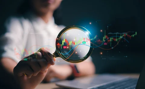 Person at a laptop querying FX candlestick chart