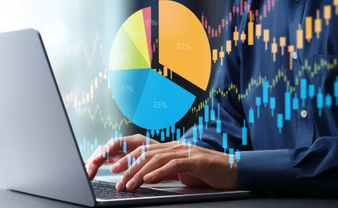 A segmented pic chart superimposed over a person’s hands on a keyboard