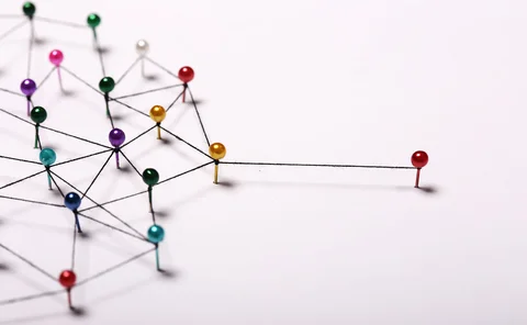 Pins in a board are connected by threads