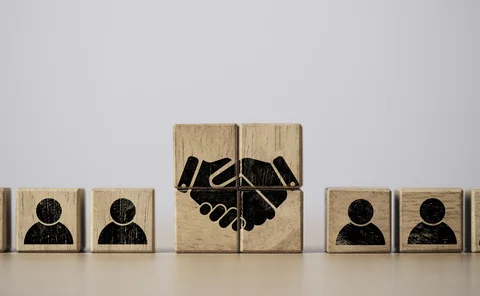 Hand shaking print screen on wooden block cube 