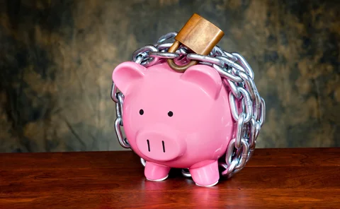 a piggy bank in chains