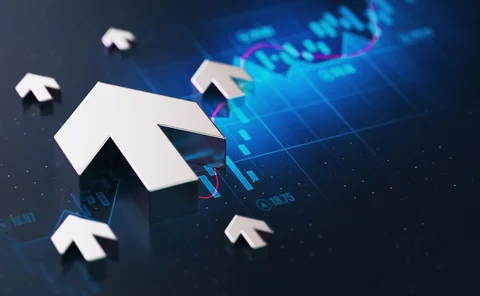 Arrows point upwards over a screen showing chart data