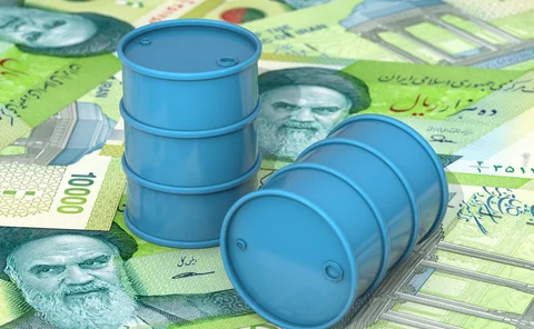 Blue barrels of oil lie on background of Iranian rial banknotes
