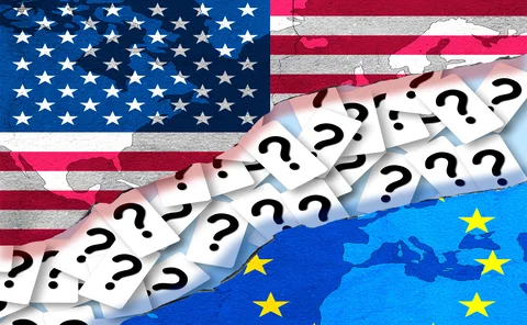EU and US flags are separated by a rift consisting of many question marks