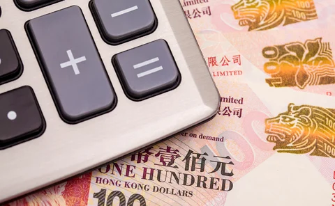 Calculator on top of Hong Kong dollar banknotes