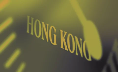 Hong Kong signage behind clock detail
