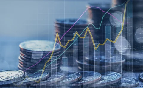 Double exposure of graph and stack of coins 