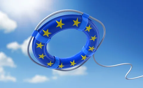 A life belt with the EU flag styling on it is being thrown into the water