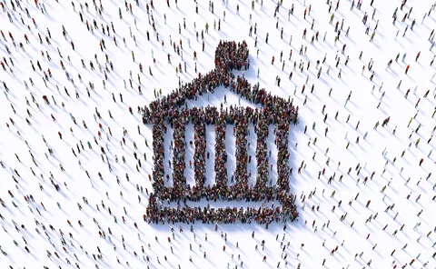 Human crowd forming a bank symbol on white background.
