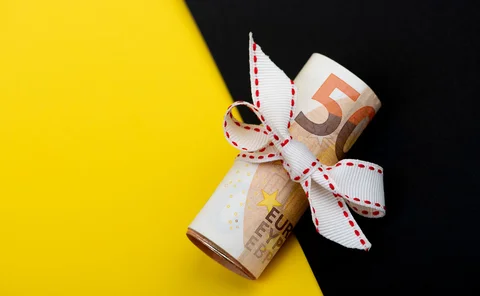 Euro notes are wrapped with string