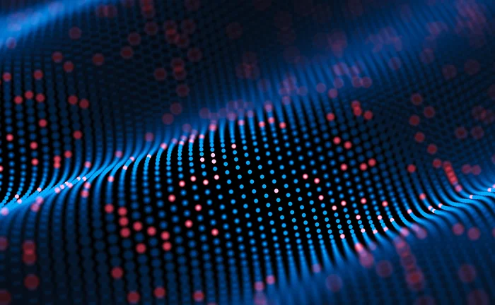 Abstract visualization of digital data waves made of glowing blue and red dots, representing big data flow, network connections, and information processing