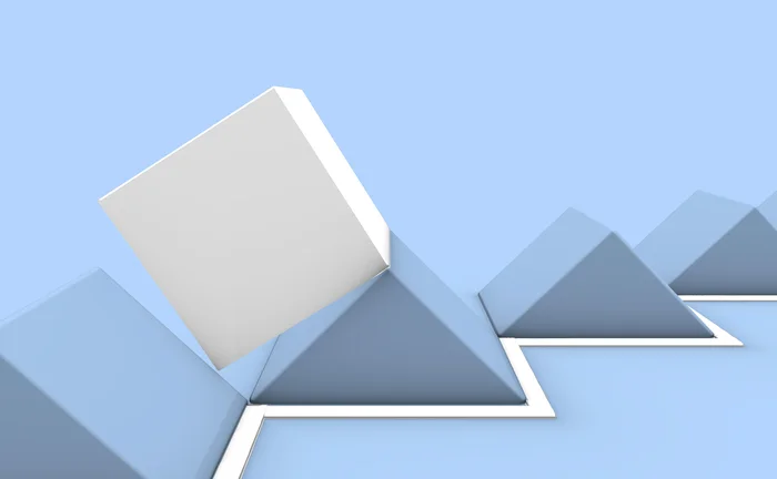 A series of blue pyramid shapes, with a white cube shape traversing along on top of them