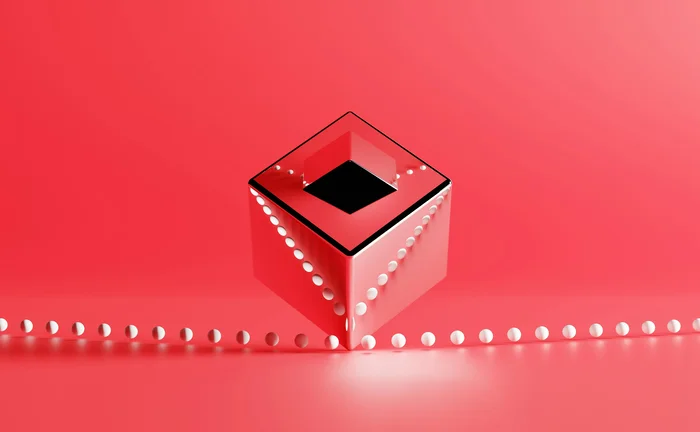 Abstract, reflective, red cube with a dark square opening floating above a row of small white spheres on a pinkish-red background