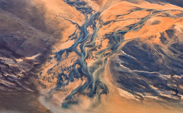 aerial view of streams feeding into a river delta