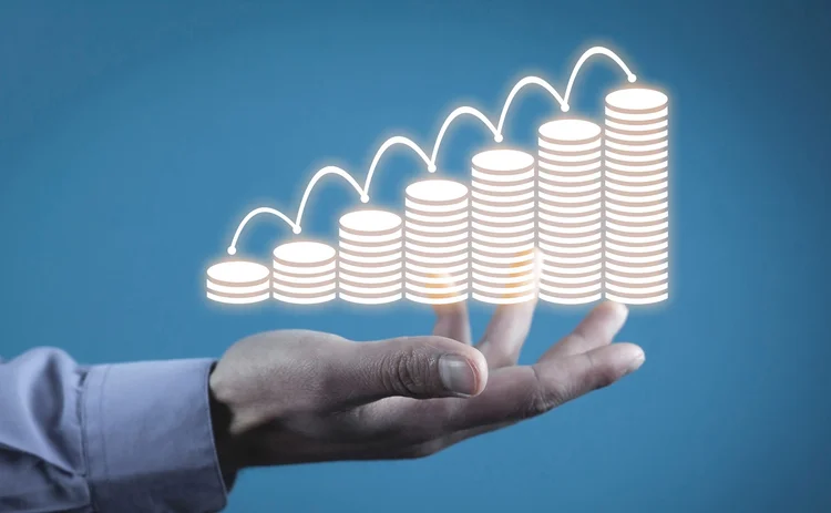 A bar chart made up of coins is increasing in height