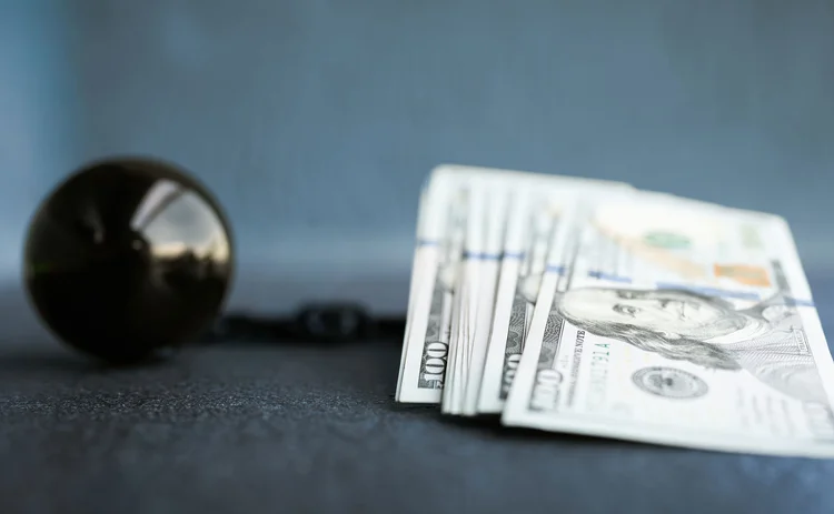 Dollars with ball and chain