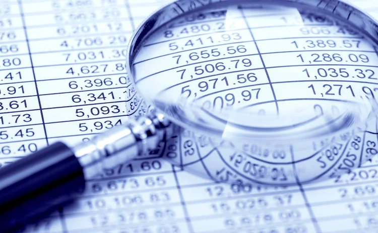 Financial-statement and magnifying glass