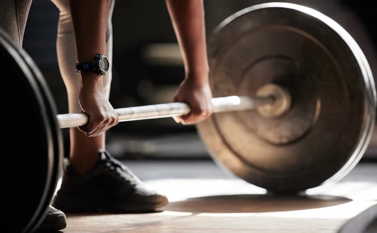 A weight-lifter lifting barbells