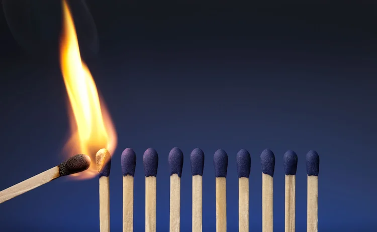 A row of matches, and the first one is about to be lit with another flame